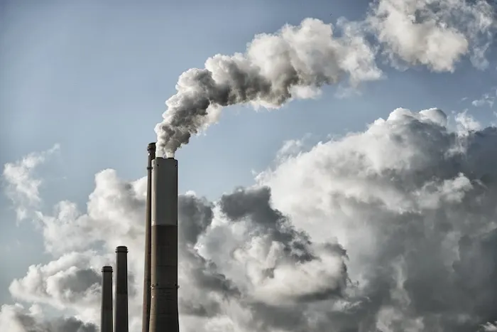 Climate change causes - dirty pollution leaving industrial chimney